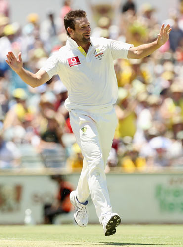 Ben Hilfenhaus of Australia celebrates the wicket of Zaheer Khan of India during day three of the Third Test match between Australia and India at WACA