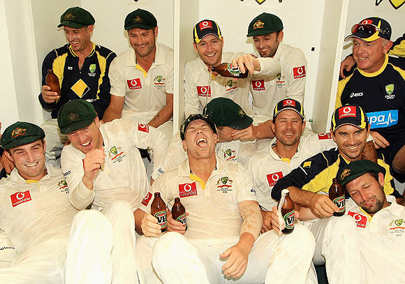 The Australian team celebrate in the dressing room after winning the third Test