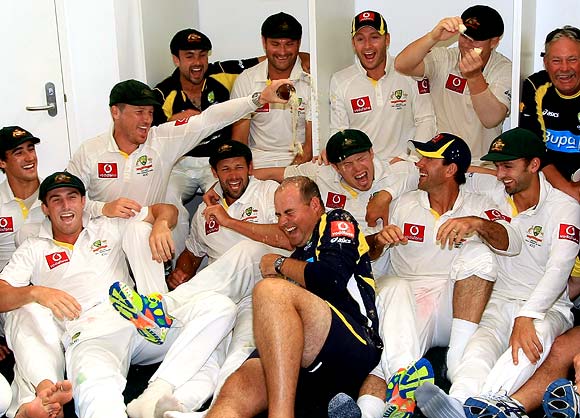 The Australian team celebrate winning the third Test in Perth