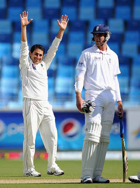 Saeed Ajmal celebrates after picking up a wicket against England in Dubai