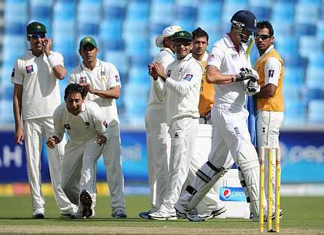 Saeed Ajmal reacts after picking up the wicket of Kevin Pietersen