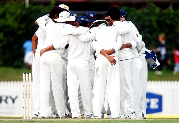 The Indian cricket team in a huddle