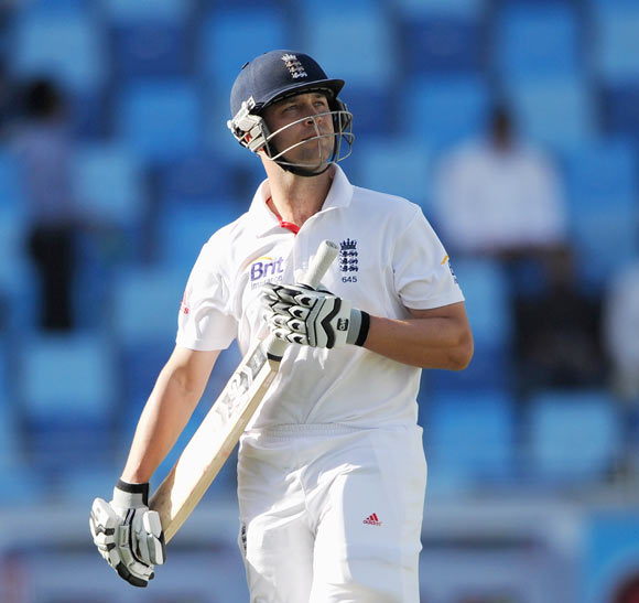 Jonathan Trott of England leaves the field after being dismissed by Umar Gul of Pakistan during the first Test match