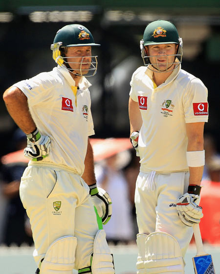 Michael Clarke (R) and Ricky Ponting talk between overs during their 386-run partnership during day two of the fourth Test