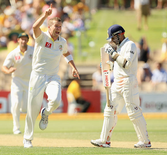 Peter Siddle celebrates after taking the wicket of Virender of Sehwag