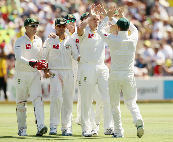 Peter Siddle of Australia celebrates the wicket of Sachin Tendulkar of India with team mates during day three of the Fourth Test