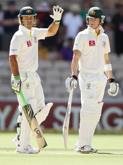 Michael Clarke (R) and Ricky Ponting (L) of Australia during day four of the Fourth Test Match between Australia and India at Adelaide Oval