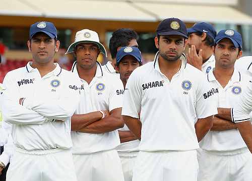 MS Dhoni and teammates look on after losing the fourth Test in Adelaide