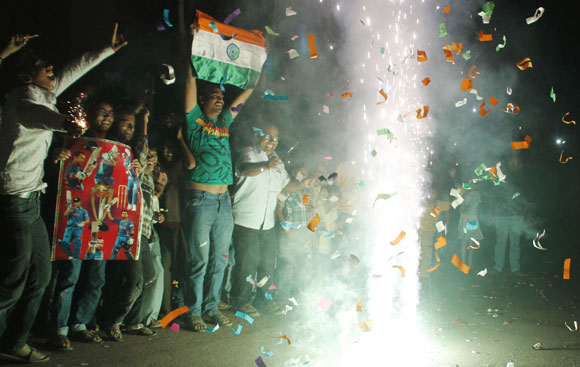 Fans in Allahabad celebrate India's win over Pakistan in the Asia Cup