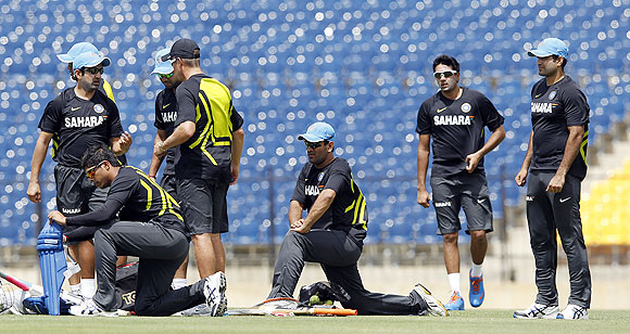 India's Mahendra Singh Dhoni (centre) and teammates attend at a practice session ahead of their first ODI against Sri Lanka in Hambantota