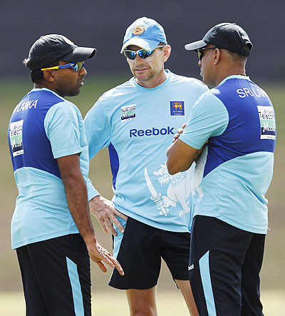 Sri Lanka's captain Mahela Jayawardene (left) talks with coach Graham Ford (centre) during a practice session on Friday