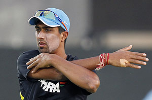 India's Rahul Sharma stretches during a practice session ahead of the first ODI against Sri Lanka in Hambantota