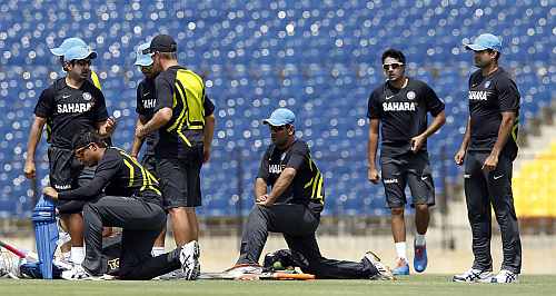 Indian players warm up during a practice session ahead of their first One Day International match against Sri Lanka in Hambantota