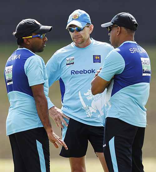 Sri Lanka's captain Mahela Jayawardene talks with coach Graham Ford during a practice session