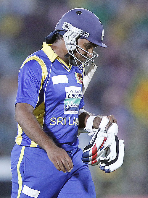 Sri Lanka's captain Mahela Jayawardene walks off the field after his dismissal