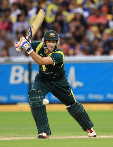 Michael Hussey of Australia drives during the One Day International match between Australia and Sri Lanka at Melbourne Cricket Ground