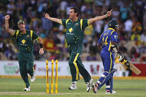 Clint McKay celebrates after picking up a wicket