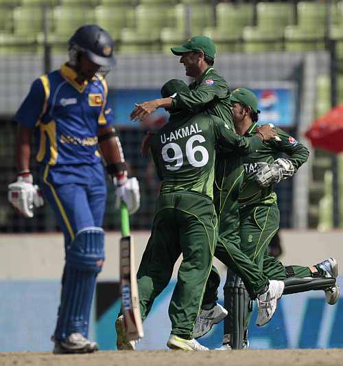 Pakistan players celebrate after the dismissal of Dinesh Chandimal