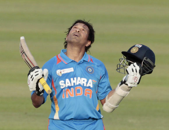 India's Sachin Tendulkar celebrates after he scored his 100th international centuries during their Asia Cup One Day International (ODI) cricket match against Bangladesh in Dhaka