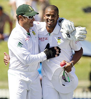 South Africa's Vernon Philander (right) is congratulated by teammate Mark Boucher after taking 10 wickets in the match on day three of the second Test against New Zealand in Hamilton on Saturday