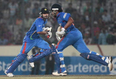 Virat Kohli and Rohit Sharma run in between wickets during their match against Pakistan