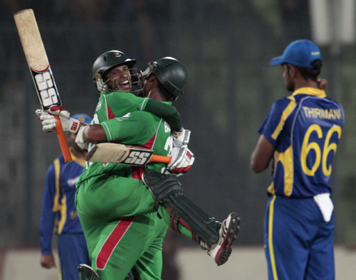 Bangladesh's Nasir Hossain and Mahmudullah celebrate after winning their match against Sri Lanka in Mirpur