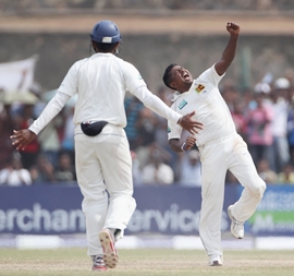 Rangara Herath celebrates taking the wicket of Graeme Swann during day 4