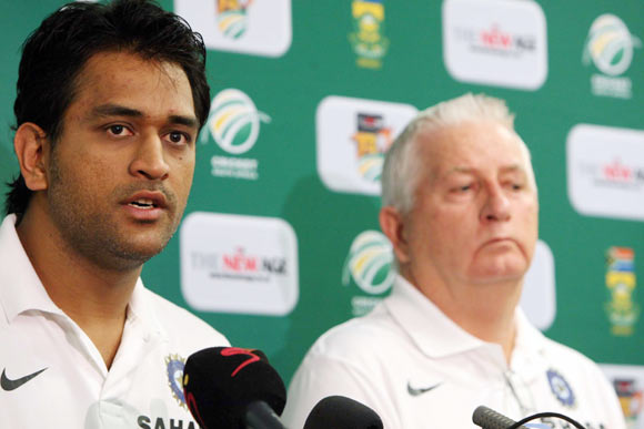 Captain MS Dhoni of India speaks beside coach Duncan Fletcher during a press conference at ACSA Media Centre