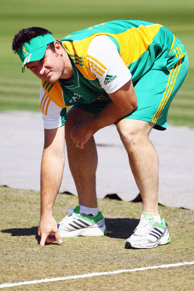 Graeme Smith feels the pitch during a training session at Seddon Park on March 14, 2012 in Hamilton