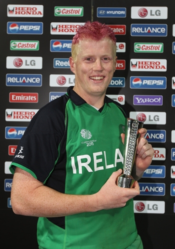 Kevin O'Brien of Ireland poses with the man of the match trophy after Ireland shocked England in the World Cup