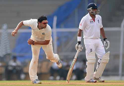 Yuvraj Singh bowls during a practice game