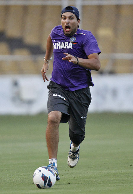 India's Yuvraj Singh plays with a soccer ball during a practice session on Tuesday