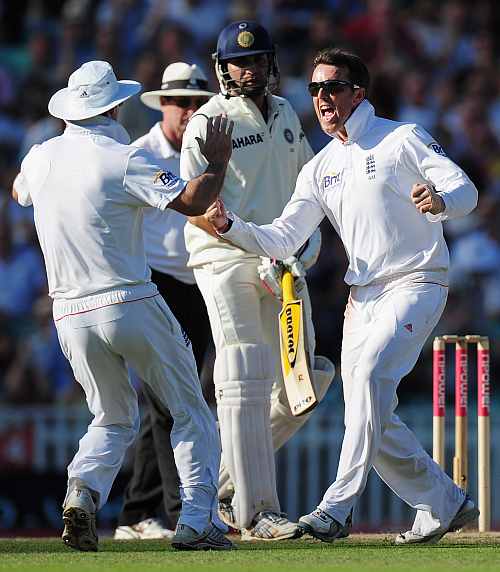 Graeme Swann celebrates the fall of a wicket during India's tour to England