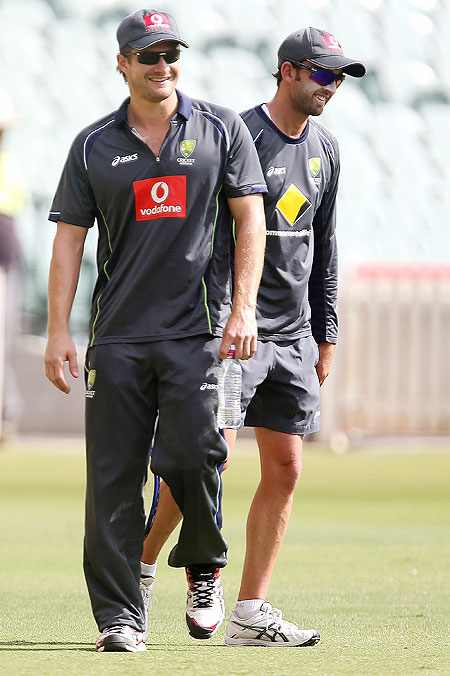 Shane Watson and Nathan Lyon smile during a training session at Adelaide Oval on Tuesday