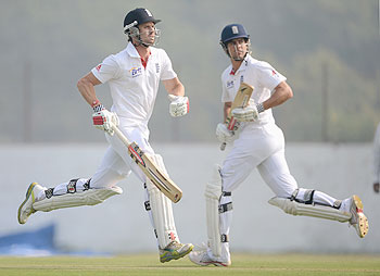Alastair Cook and Nick Compton of England run between the wickets