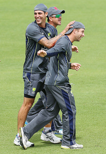 Mitchell Johnson and Matthew Wade celebrate winning a warm up game during an Australian training session at WACA, Perth on Wednesday