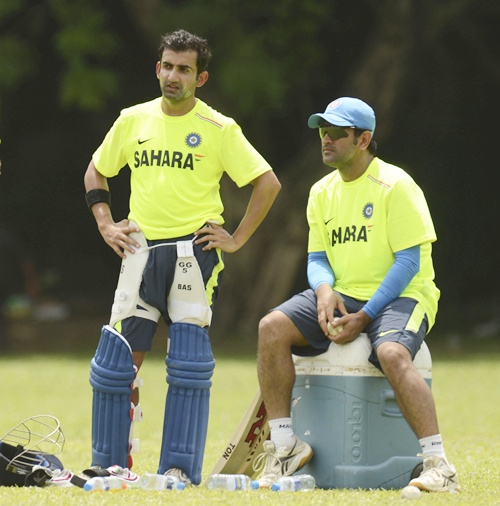 Gautam Gambhir and captain Mahendra Singh Dhoni (right) look on at a training session
