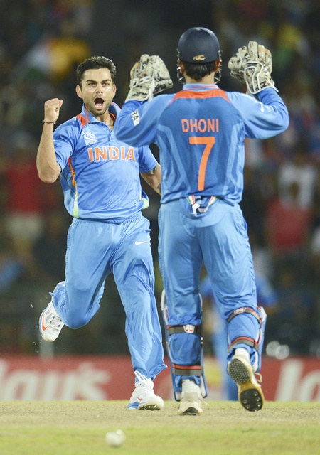 India's Virat Kohli (left) celebrates with Mahendra Singh Dhoni