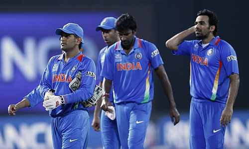 India's captain MS Dhoni leads his men off the field