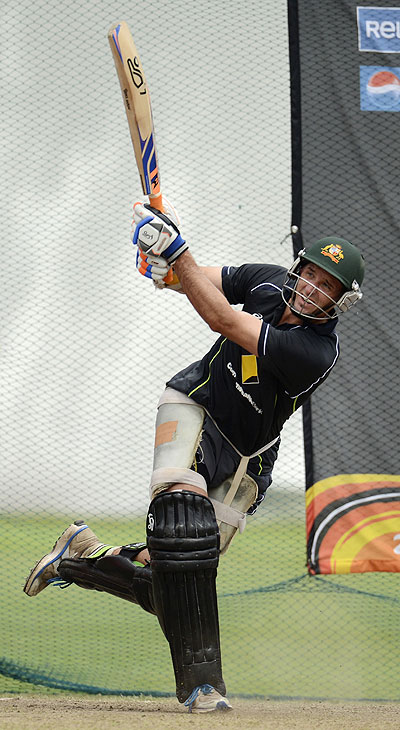 Australia's Michael Hussey hits out during a training session at Colts cricket ground