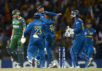 Rangana Herath of Sri Lanka celebrates with Mahela Jayawardene after bowling Shahid Afridi