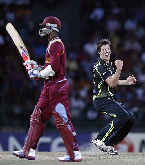Australia's Pat Cummins celebrates after taking the wicket of West Indies Marlon Samuels during their Twenty20 World Cup semi-final match in Colombo