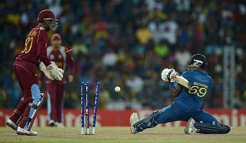 Angelo Mathews of Sri Lanka is bowled by Darren Sammy of the West Indies during the ICC World Twenty20 2012 Final between Sri Lanka and the West Indies