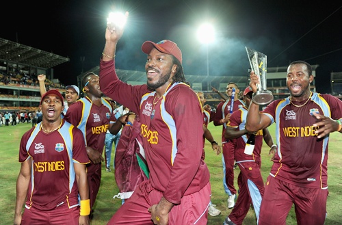 Dwayne Bravo, Chris Gayle and Dwayne Smith of the West Indies celebrate