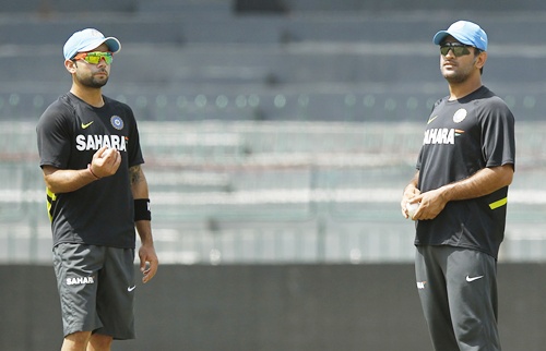 India's captain Mahendra Singh Dhoni (right) talks to Virat Kohli