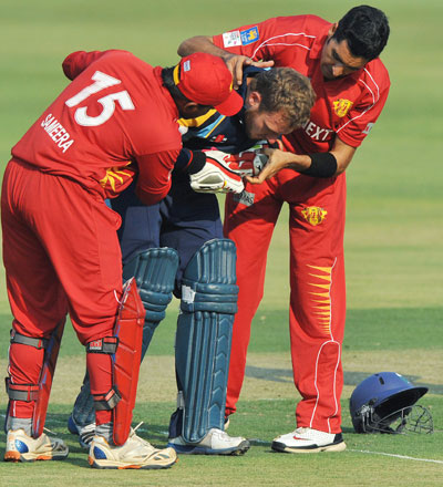 David Miller of Yorkshire receives attention after being struck by Umar Gul of Uva
