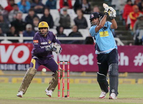 Azhar Mahmood of the Auckland Aces (right) bats during the CLT20 match against Kolkata Knight Riders