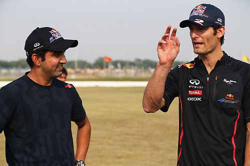 Mark Webber of Australia and Red Bull Racing meets Indian cricketer Gautam Gambhir during previews for the Indian Formula One Grand Prix