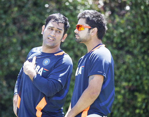 India's captain Mahendra Singh Dhoni (left) talks to teammate Virat Kohli