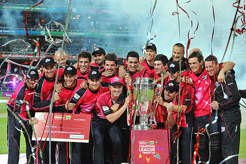 The Sydney Sixers celebrate with the trophy after winning the CLT20 final against Highveld Lions on Sunday